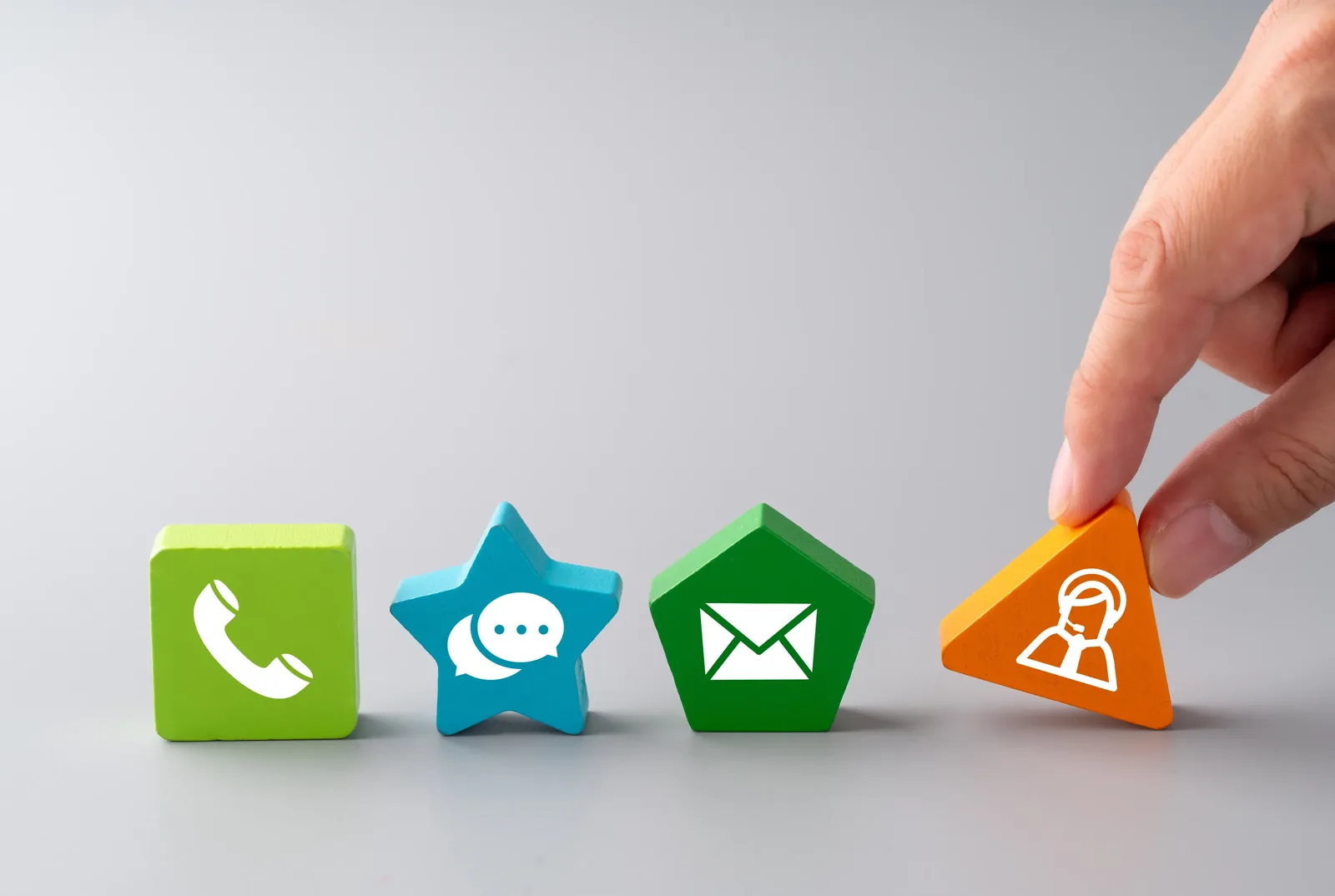 Colourful call, message, email and support icons arranged together, representing ways to get in touch