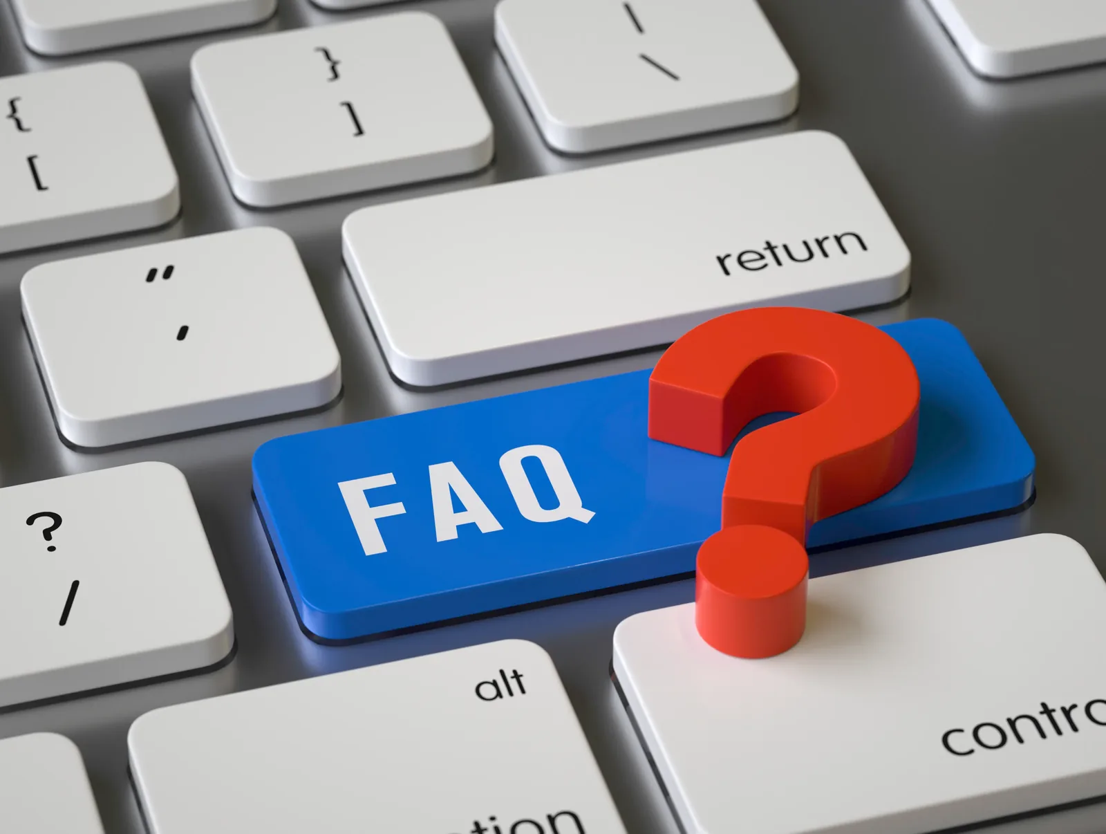 A keyboard with a highlighted FAQ key and question mark, representing frequently asked questions