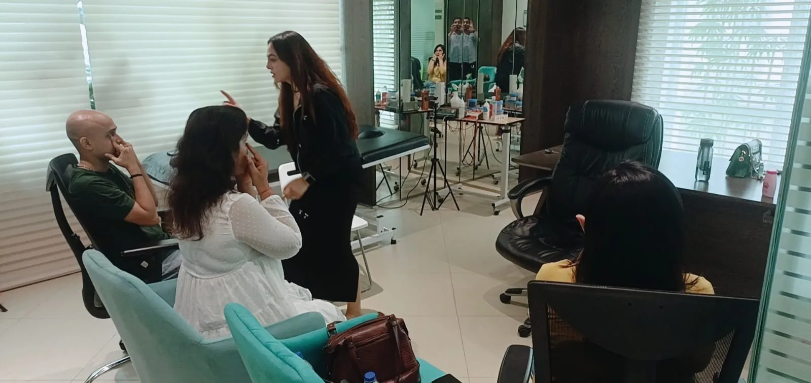 Vibha Jain working with clients in her consultation space during a session