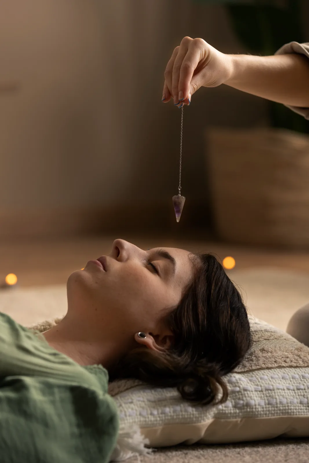 A person resting comfortably with eyes closed during a calm, guided relaxation session